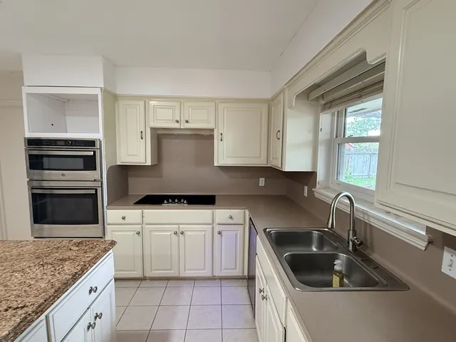 Before: the cooktop corner and wall ovens