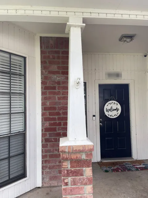 Porch column by the front door