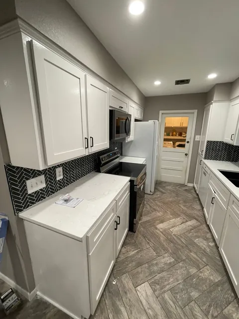 White cabinets along the wall