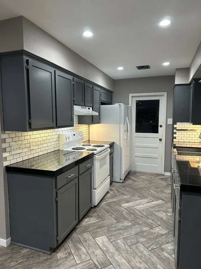 Before: slate cabinets and dark countertops