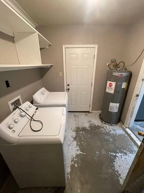 Before: water heater corner and concrete floor