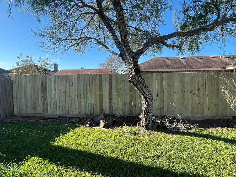New wood privacy fence across a backyard