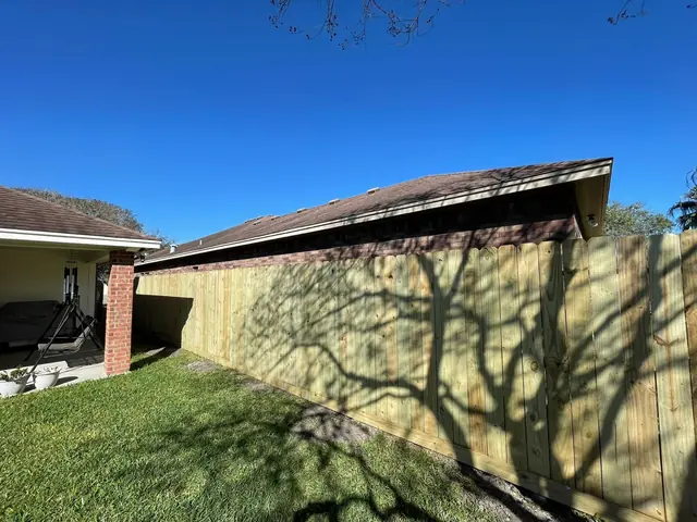 Fence meeting the house