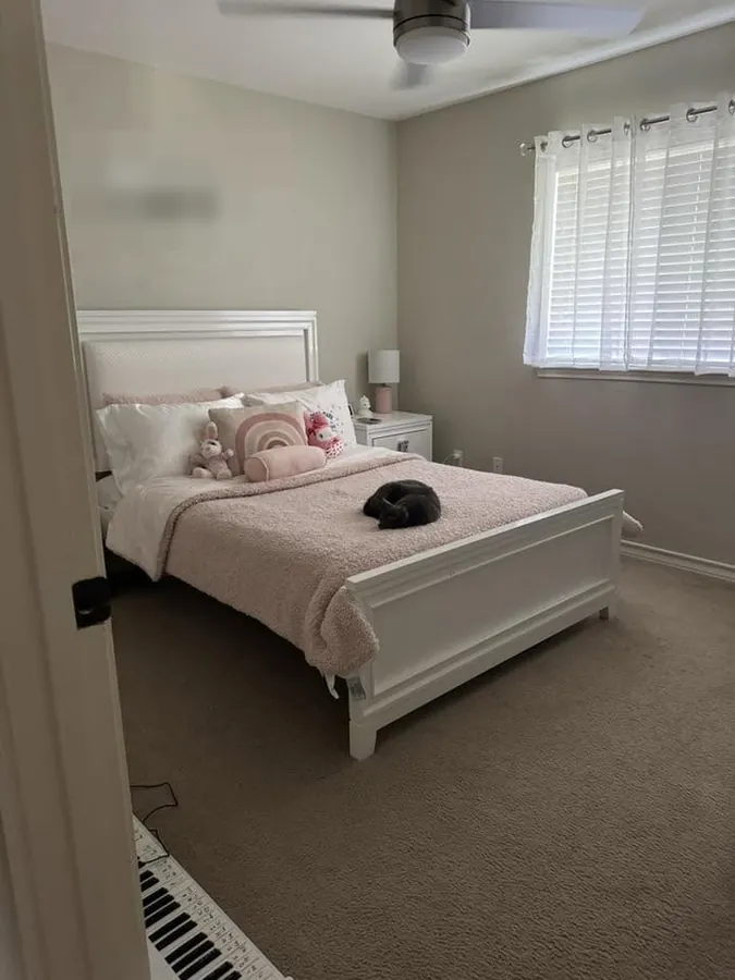 Bedroom with a new paneled accent wall behind the bed