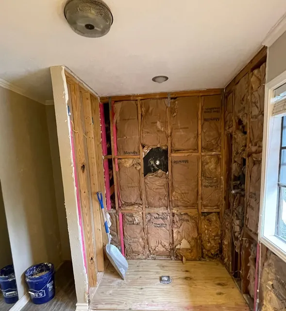 The framing behind the old shower